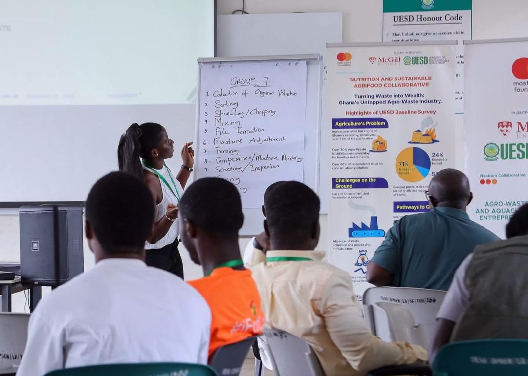 a student is speaking to fellow nkabom collaborative students